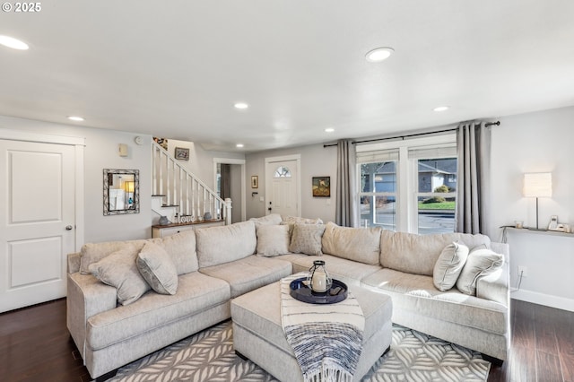 living area with stairs, dark wood-type flooring, recessed lighting, and baseboards