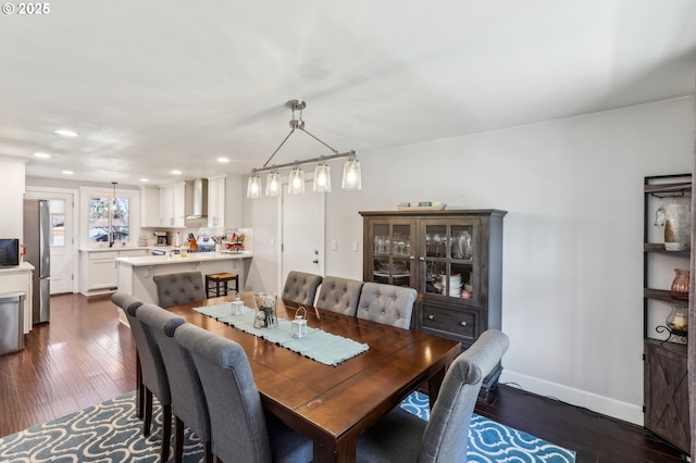 dining room with recessed lighting, baseboards, and dark wood-style flooring