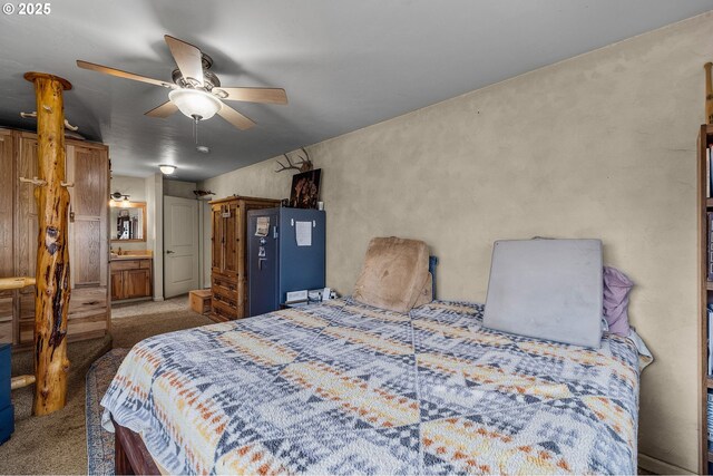 bedroom with a ceiling fan and carpet flooring