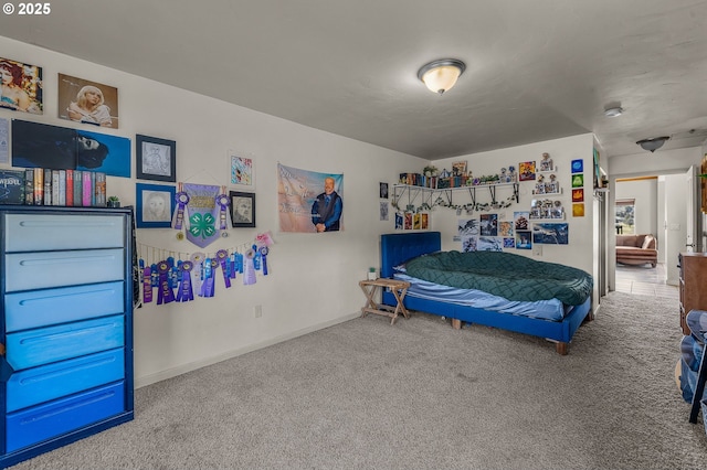 bedroom with carpet flooring and baseboards