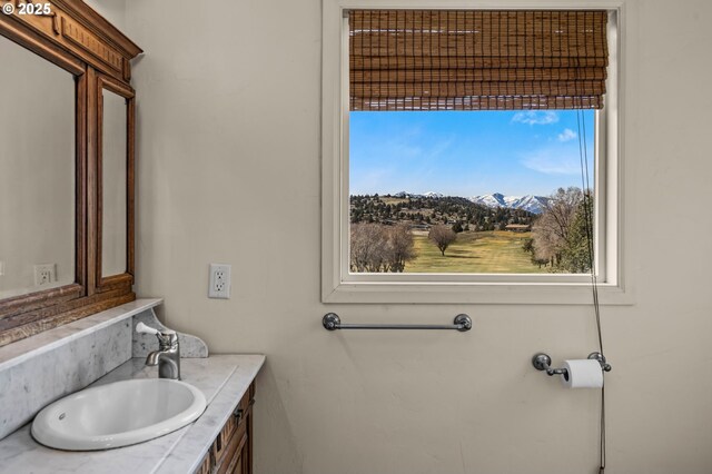 bathroom with vanity and a mountain view