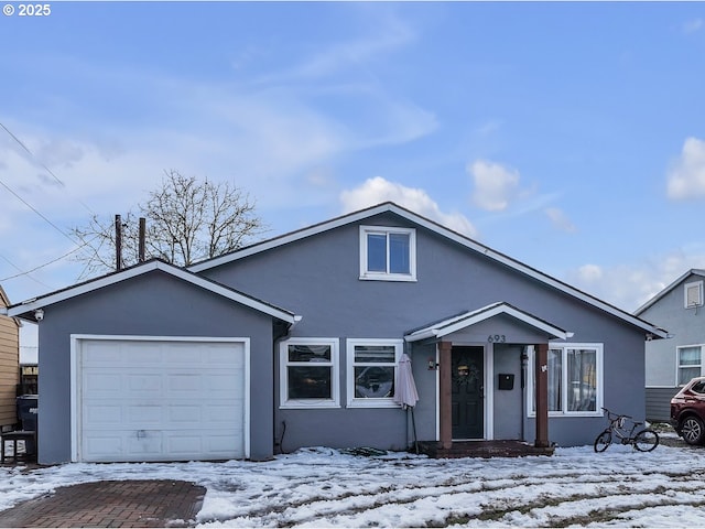 view of front facade with an attached garage and stucco siding