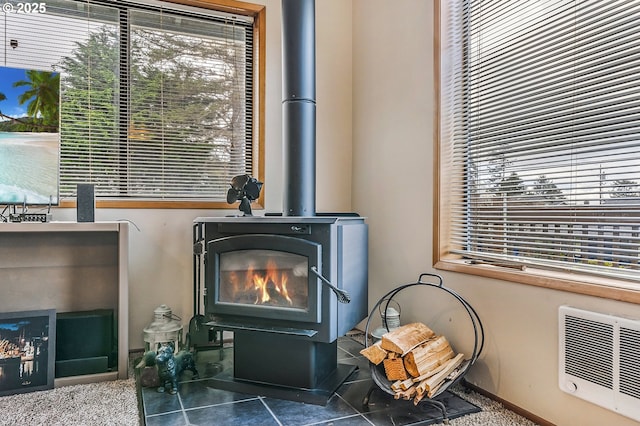 details featuring visible vents and a wood stove