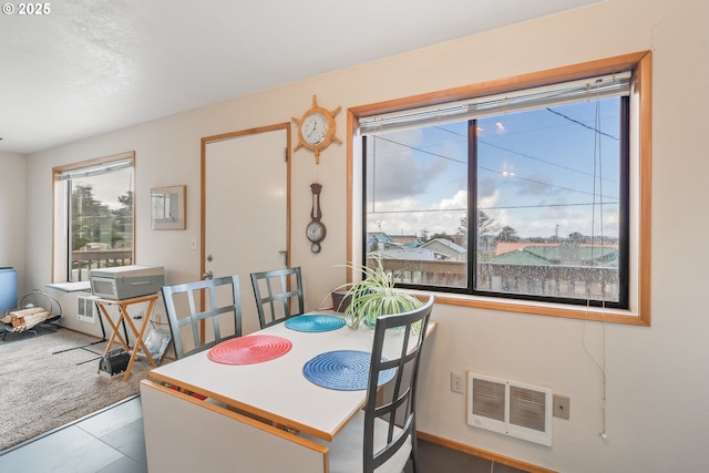 carpeted dining area with visible vents