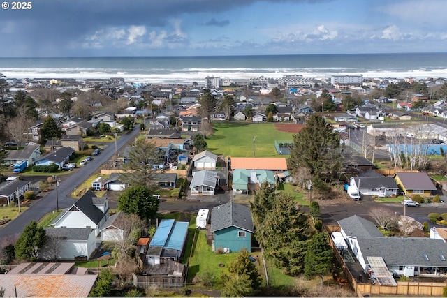 drone / aerial view with a residential view and a water view