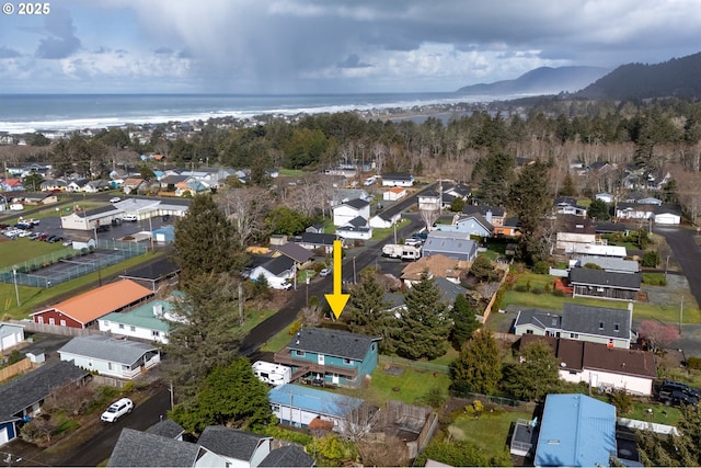 birds eye view of property featuring a water view and a residential view