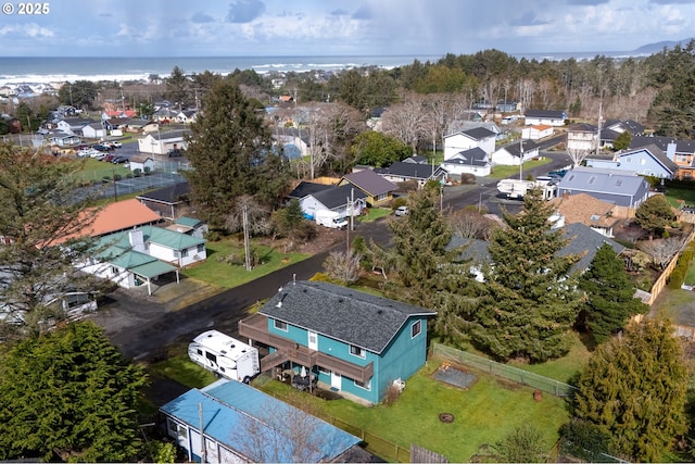 aerial view featuring a water view and a residential view