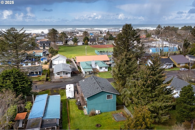 bird's eye view with a residential view and a water view