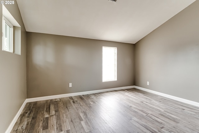 284 Waite St, Eugene, OR 97402 - empty room featuring wood finished floors, baseboards, and lofted ceiling
