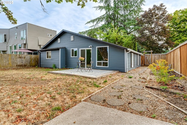 284 Waite St, Eugene, OR 97402 - rear view of house with a fenced backyard and a patio