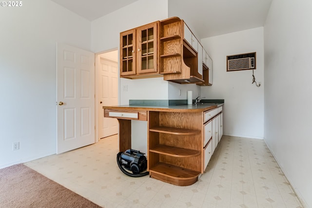 284 Waite St, Eugene, OR 97402 - kitchen with open shelves, baseboards, light floors, and glass insert cabinets