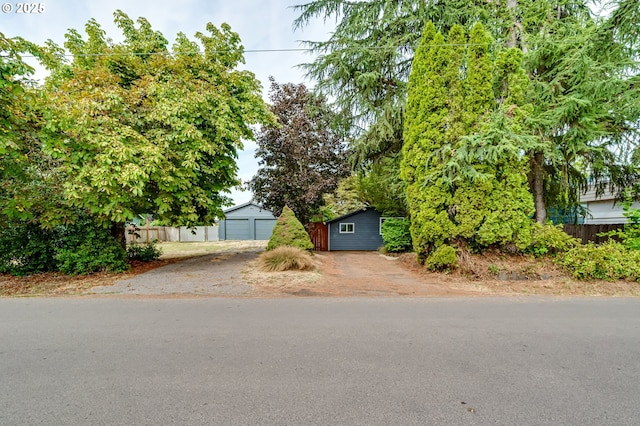284 Waite St, Eugene, OR 97402 - obstructed view of property with an outdoor structure and a garage