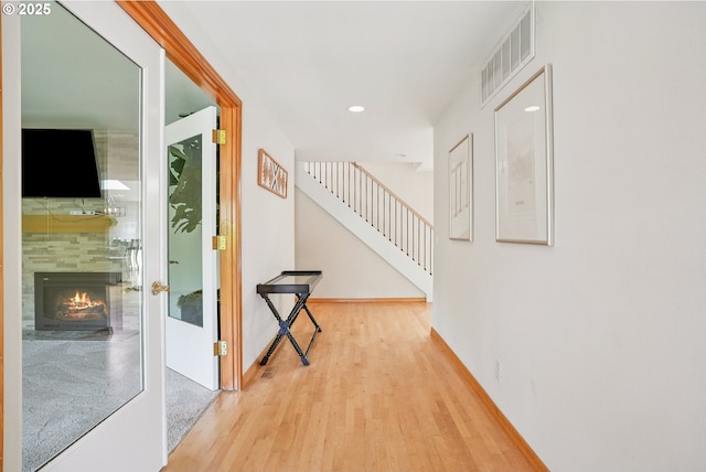 8895 SW Bohmann Pkwy, Portland, OR 97223 - hallway with wood finished floors, stairway, recessed lighting, and baseboards