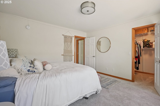 8895 SW Bohmann Pkwy, Portland, OR 97223 - bedroom with a walk in closet, carpet flooring, a closet, and baseboards