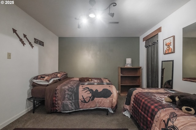 bedroom with carpet floors and baseboards