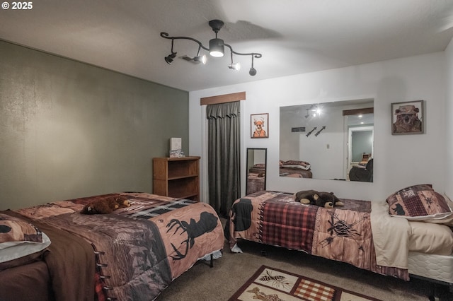 carpeted bedroom with a closet and a ceiling fan