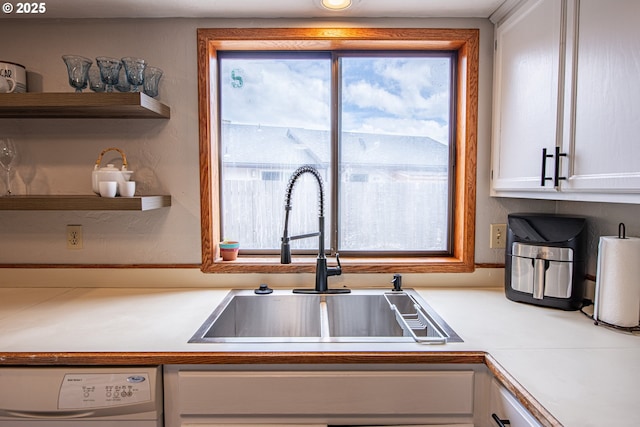 3308 Honeywood St, Eugene, OR 97408 - kitchen with a sink, white cabinets, washer / clothes dryer, open shelves, and light countertops