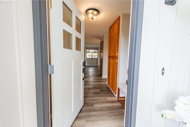 3308 Honeywood St, Eugene, OR 97408 - corridor featuring light wood-style flooring, a textured ceiling, and baseboards