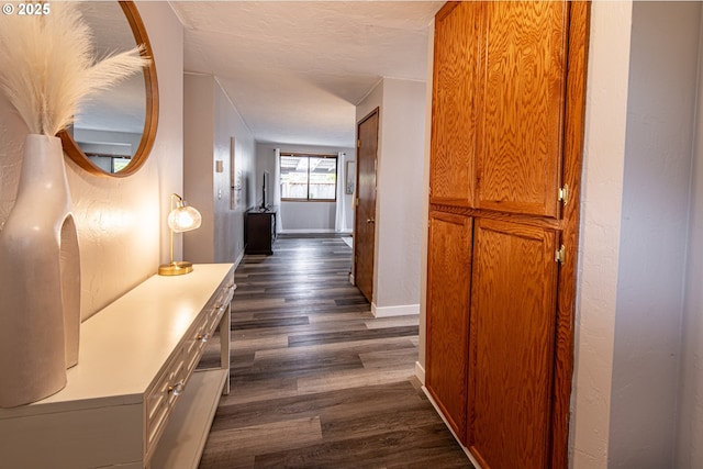 3308 Honeywood St, Eugene, OR 97408 - corridor featuring dark wood-style flooring, baseboards, and a textured ceiling