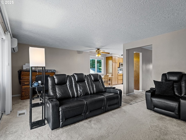3311 SE 1st St, Gresham, OR 97080 - living room featuring light colored carpet, ceiling fan, a textured ceiling, an AC wall unit, and baseboards