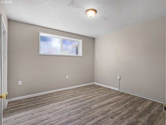 3311 SE 1st St, Gresham, OR 97080 - spare room with wood finished floors, baseboards, and a textured ceiling