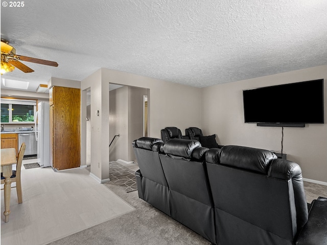3311 SE 1st St, Gresham, OR 97080 - living area featuring light carpet, ceiling fan, baseboards, and a textured ceiling