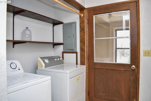 washroom with laundry area, electric panel, and separate washer and dryer