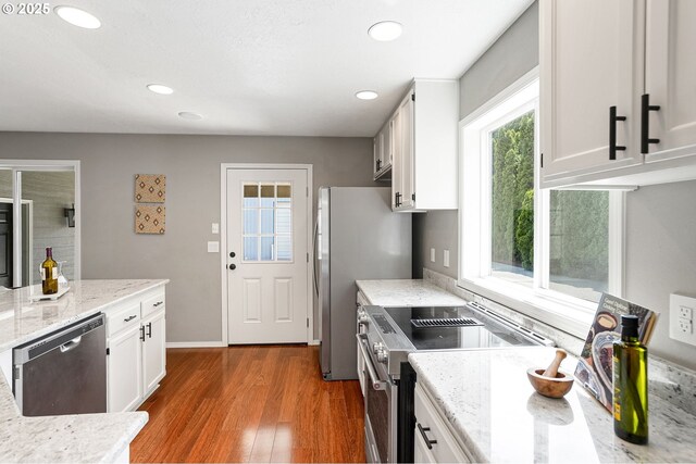 4782 Lowell Ave, Keizer, OR 97303 - kitchen with appliances with stainless steel finishes, plenty of natural light, wood finished floors, white cabinets, and recessed lighting