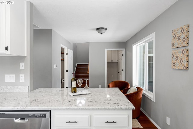 4782 Lowell Ave, Keizer, OR 97303 - kitchen with stainless steel dishwasher, wood finished floors, a peninsula, and white cabinets