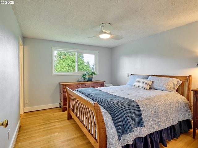 13601 S Union Hall Rd, Canby, OR 97013 - bedroom featuring wood finished floors, baseboards, ceiling fan, and a textured ceiling