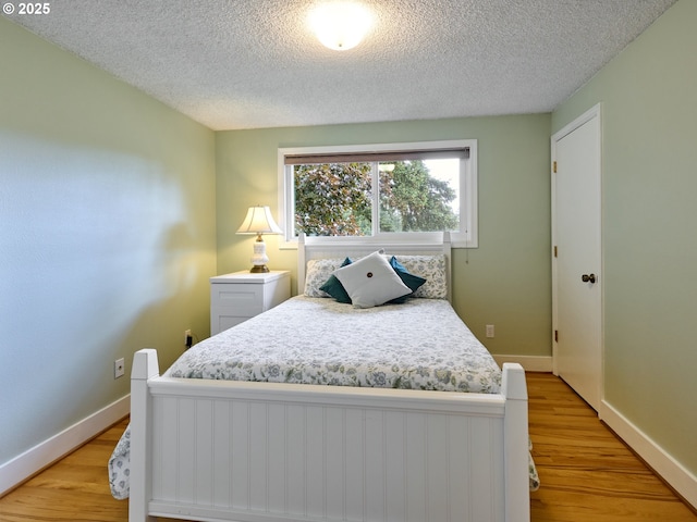 13601 S Union Hall Rd, Canby, OR 97013 - bedroom with a textured ceiling and light wood-type flooring