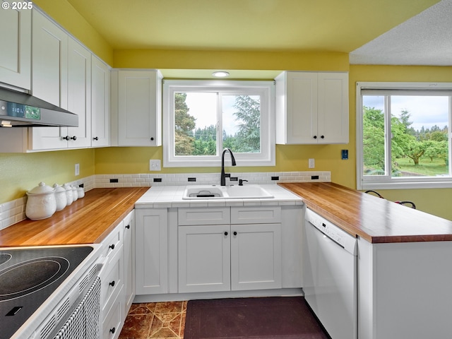 13601 S Union Hall Rd, Canby, OR 97013 - kitchen featuring white appliances, a peninsula, extractor fan, white cabinetry, and decorative backsplash