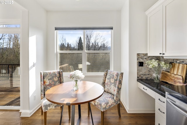 dining space featuring dark wood-type flooring