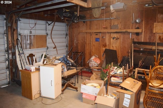 garage featuring wood walls