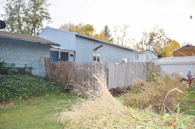 view of home's exterior featuring fence