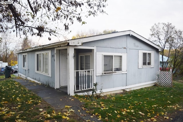 view of property exterior with a yard