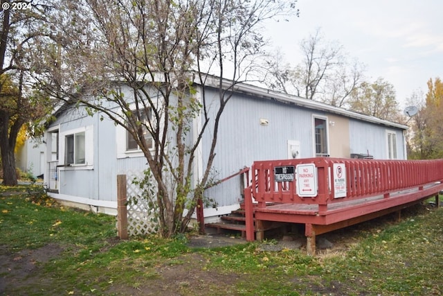 back of property with a wooden deck