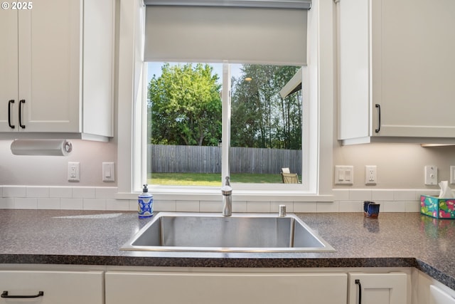 219 W Christy Ct, Yacolt, WA 98675 - kitchen featuring dark countertops, white cabinetry, and backsplash