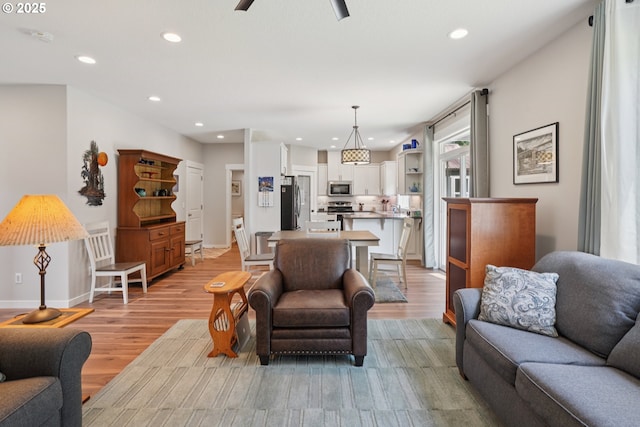 219 W Christy Ct, Yacolt, WA 98675 - living room with recessed lighting, light wood-style flooring, baseboards, and ceiling fan