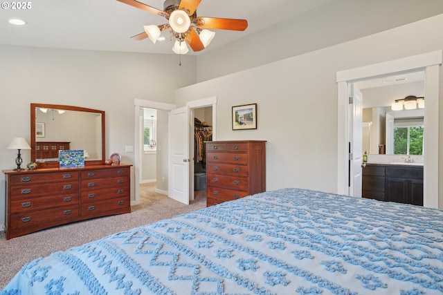 219 W Christy Ct, Yacolt, WA 98675 - bedroom featuring carpet floors, a walk in closet, vaulted ceiling, ensuite bathroom, and a closet