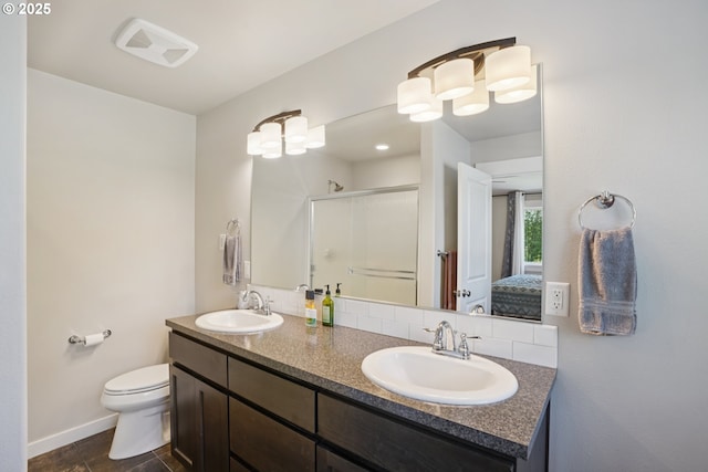 219 W Christy Ct, Yacolt, WA 98675 - bathroom with a shower stall, double vanity, baseboards, and toilet