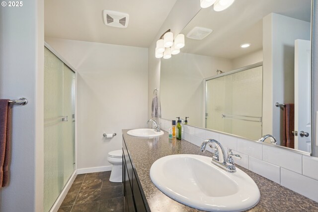 219 W Christy Ct, Yacolt, WA 98675 - bathroom with baseboards, toilet, and a shower stall