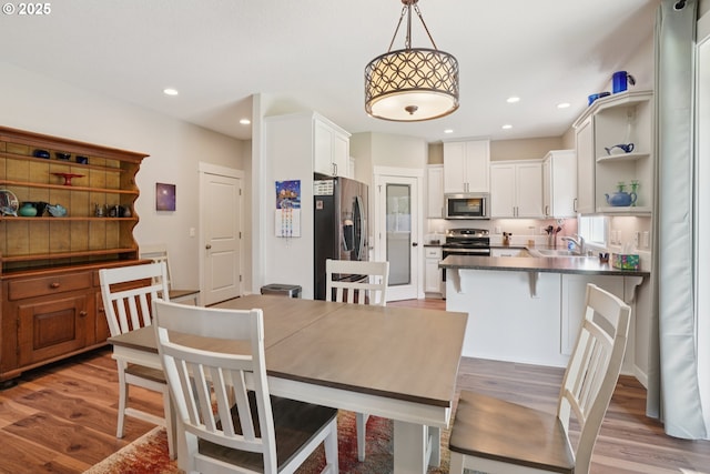 219 W Christy Ct, Yacolt, WA 98675 - dining room with light wood finished floors and recessed lighting