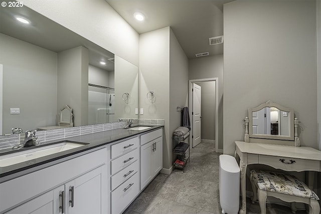 full bathroom featuring an enclosed shower, visible vents, a sink, and double vanity