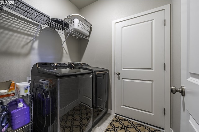 washroom with laundry area and separate washer and dryer