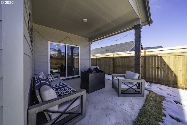 view of patio featuring fence