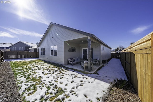 back of house featuring a patio area and a fenced backyard