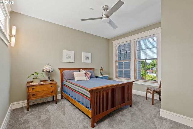 bedroom featuring carpet floors, a ceiling fan, and baseboards
