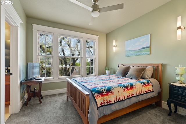 carpeted bedroom featuring baseboards and a ceiling fan