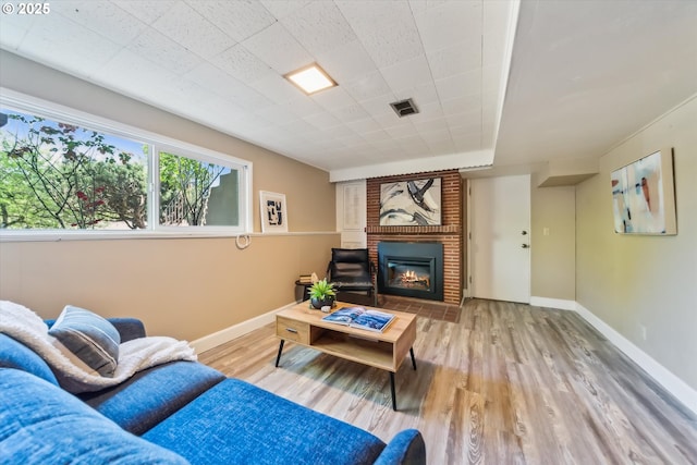 7323 SW Nevada Ter, Portland, OR 97219 - living area featuring wood finished floors and a fireplace